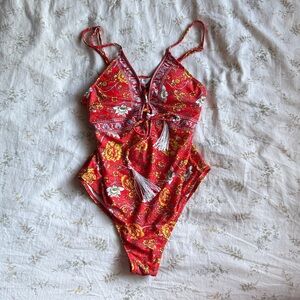 One piece multipcolored bathing suit size small never worn excellent condition